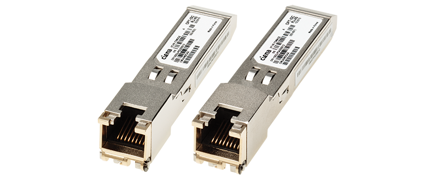 Two Ciena networking transceivers with metallic casings and labeled with product information.